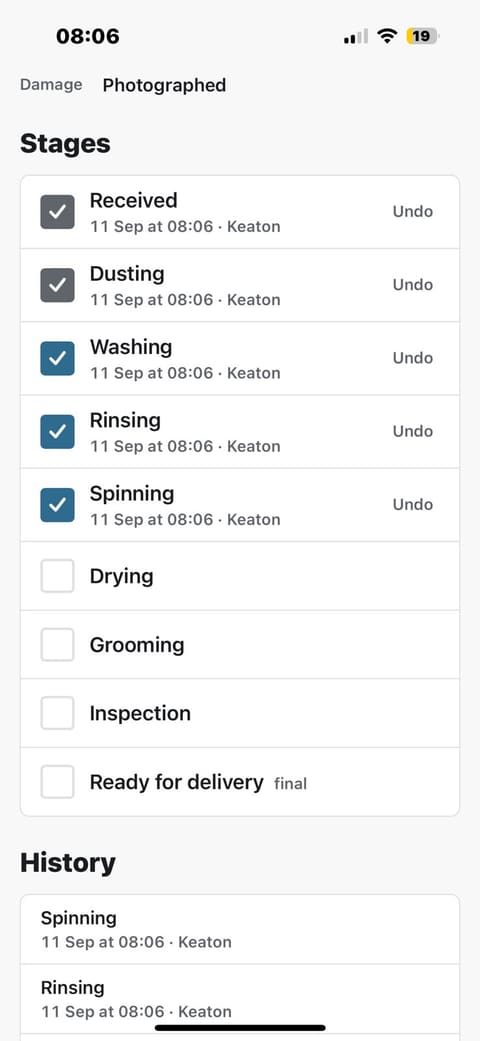 A rug's stage list: Received, Dusting, Washing, Rinsing and Spinning ticked, each stamped '11 Sep at 08:06 · Keaton' with an Undo beside it, Drying, Grooming, Inspection and Ready for delivery still open, and the history below.