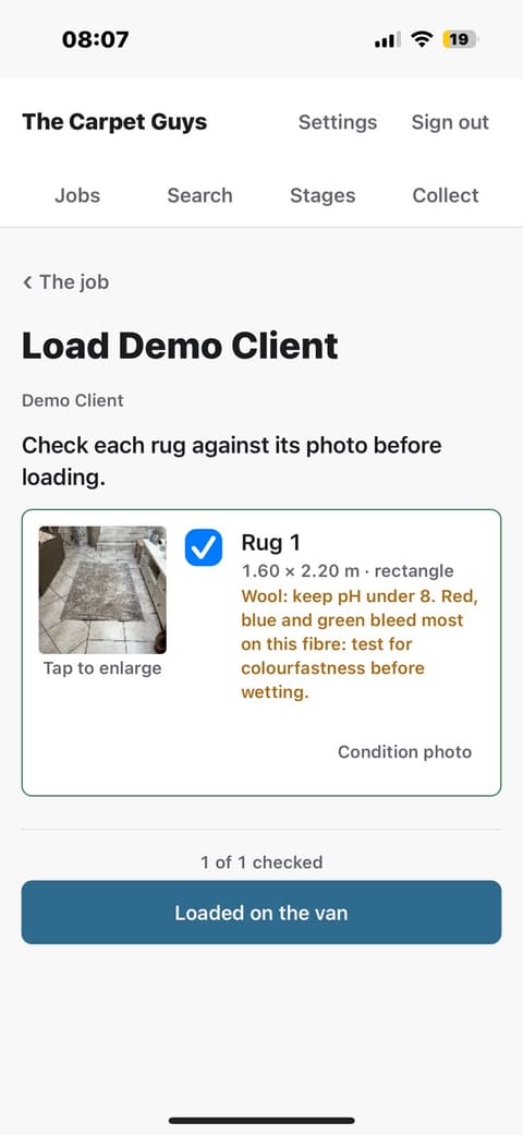 The load checklist, headed 'Check each rug against its photo before loading': the rug's thumbnail beside a ticked blue checkbox, its size, shape and fibre warning, '1 of 1 checked', and a Loaded on the van button.
